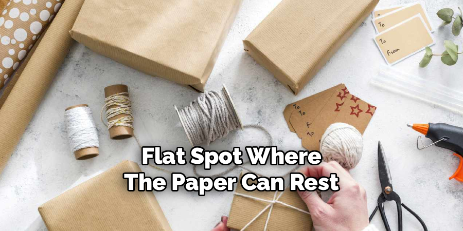 Flat Spot Where
The Paper Can Rest